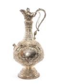 FINE VICTORIAN SILVER ARMADA PATTERN CLARET JUG, Barnard & Sons, London 1897, of baluster shape with