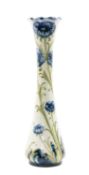 WILLIAM MOORCROFT FOR JAMES MACINTYRE & CO: FLORIAN STEM VASE, with undulating rim, painted with