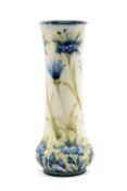 WILLIAM MOORCROFT FOR JAMES MACINTYRE & CO: FLORIAN VASE, painted with cornflowers in blue, yellow