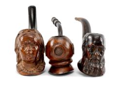 THREE NOVELTY TOBACCO PIPES including Queen Victoria, Darwin and a diver's helmet (3) Provenance: