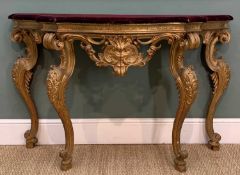 18TH C. ITALIAN CARVED GILTWOOD CONSOLE STAND, in the high rococo taste, mauve velvet covered top