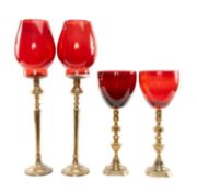 TWO PAIRS OF GLASS-MOUNTED BRASS CANDLE STICKS, glass associated, tallest 57cms (4) Provenance: