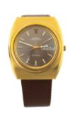 OMEGA GENEVE MEGAQUARTZ 32KHz WRISTWATCH, brushed gold-plated tonneau case, caramel dial with day-