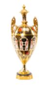 ROYAL CROWN DERBY '1128' PATTERN OVIFORM URN, with high scrolled twin foliate handles, on socle