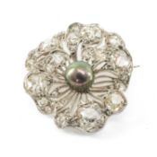 WHITE METAL DIAMOND & BLACK PEARL BROOCH, of pierced flowerhead design, encrusted with diamonds, the