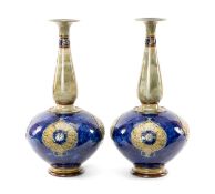 PAIR ROYAL DOULTON STONEWARE BOTTLE VASES, shape 7017, glazed green and blue with stylised floral