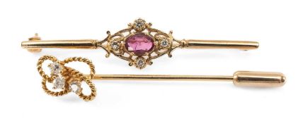 9CT GOLD BAR BROOCH & 9CT GOLD STICK PIN, the brooch mounted with central oval rub and four small