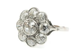 PLATINUM DIAMOND NINE STONE CLUSTER RING of flowerhead design, the central diamond (0.5ct approx.)