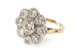 18CT GOLD NINE STONE DIAMOND CLUSTER RING, flower head design, the central diamond (0.5ct approx.)