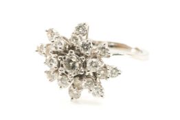 WHITE METAL DIAMOND CLUSTER RING set with nineteen round cut diamonds (0.05ct each approx.), ring
