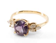 9CT COLOUR CHANGE SAPPHIRE & DIAMOND RING, oval mixed cut stone 8 x 8.5mms approx., between triple