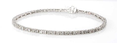 14K WHITE GOLD DIAMOND LINE / TENNIS BRACELET, 19.5cms (l), 7.1gms in box Provenance: private