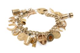 9CT GOLD CHARM BRACELET, heart shaped padlock, with fourteen 9ct gold charms including coracle,