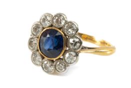 18CT GOLD SAPPHIRE & DIAMOND CLUSTER RING, the central sapphire (6 x 5mms) within border of ten