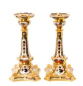 PAIR OF ROYAL CROWN DERBY '1128' PATTERN IMARI CANDLESTICKS, lavishly decorated in typical