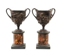 AFTER THE ANTIQUE, PAIR OF PATINATED SPELTER MODEL URNS, cast in relief with classical figures,