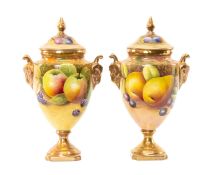 PAIR OF COALPORT PORCELAIN FRUIT PAINTED URNS & COVERS, with ram mask handles, each painted with
