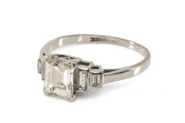 18CT WHITE GOLD FIVE STONE DIAMOND RING, the central emerald cut stone measuring 1.1cts approx.,
