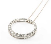 WHITE METAL DIAMOND SET CIRCULAR PENDANT ON CHAIN, claw set with thirty-two round brilliant cut