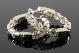 PAIR OF 14K WHITE GOLD DIAMOND HOOP EARRINGS, each set with ten round cut diamonds (0.18ct each