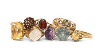 EIGHT 9CT GOLD RINGS set with citrine, amethyst, garnets, moonstone, seed pearls etc, 21.6gms