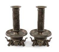 PAIR JAPANESE BRONZE CANDLESTICKS, Meiji Era, the columns cast in shallow relief with pavilions,