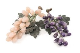 TWO CHINESE CARVED HARDSTONE MODELS OF GRAPE BUNCHES, probably table decorations, one in rose