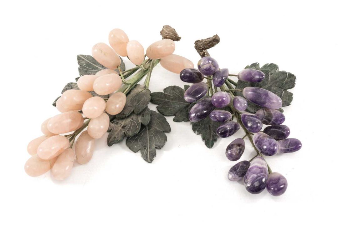 TWO CHINESE CARVED HARDSTONE MODELS OF GRAPE BUNCHES, probably table decorations, one in rose