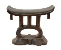 TSONGA HEADREST, rectangular bowed platform with square pendant lugs, above triple column and arch