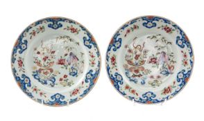 PAIR 18TH C. CHINESE FAMILLE ROSE PLATES, Qianlong, enamelled with basket of flowers, rockwork &