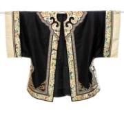 CHINESE EMBROIDERED LADY'S ROBE, late Qing dynasty, in black silk, with a broad cream border