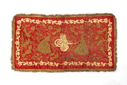 OTTOMAN GOLD THREAD EMBROIDERED SILK PANEL, 19th C., rectangular, the red silk ground with central