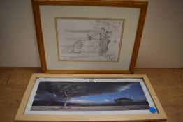Two framed prints, one Winnie the Pooh and the other Trees in the frozen countryside.