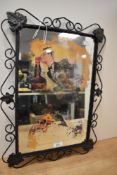 A vintage wrought iron framed advertising mirror, af, some wear.