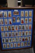 A framed collection of John Player & Son cigarette cards Coronation series Ceremonial Dress.