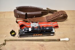 A 4X28 air rifle scope, two cartridge belts, a riding crop with integrated compass to end of