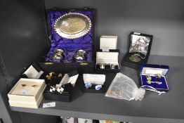 A cased silver plated condiment set, with foliate engraved design, together with an assorted