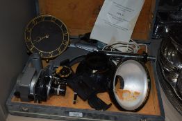 A cased vintage portable photographic autofocus enlarger, by Raduga, and a vintage Smiths circular