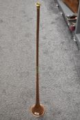 A copper and brass coaching horn.