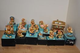 A collection of twenty two Pendelfin hand-painted Stonecraft anthropomorphic rabbit figures and