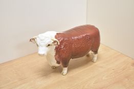 A Beswick Pottery Hereford Bull study, model number 1363A, first version with horns extending past