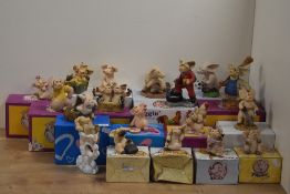 A Collection of eighteen 'Piggin' Collectible World Studios comical anthropomorphic pig figures,
