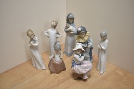 A Lladro porcelain figurine 'Girl Stretching' number 4872, printed and impressed marks to