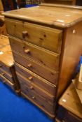 A modern pine tall chest of six drawers, approx. dimensions H107 W59 D46cm