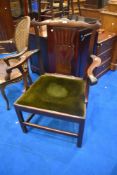 A Georgian oak carver chair having green dralon upholstered seat, width approx. 68cm