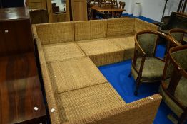 A modern wicker sectional corner settee (no cushions)
