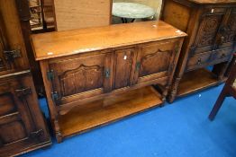 A Titchmarsh and Goodwin oak Credence, approx 107, D 34, H 76cm.