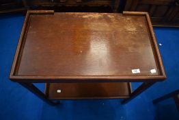 An early 20th century oak tea trolley, having fold out card table top. W 68, D 40, H 78cm.