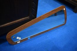 A vintage teak effect stylised wall mirror