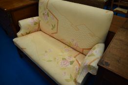 A mahogany framed settee in the traditional settle style, width approx. 143cm